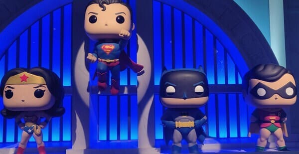 giant funko pop figures of wonder woman, superman, batman, and robin